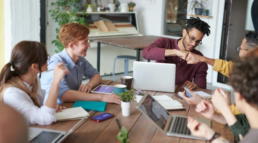 photo of men doing fist bump